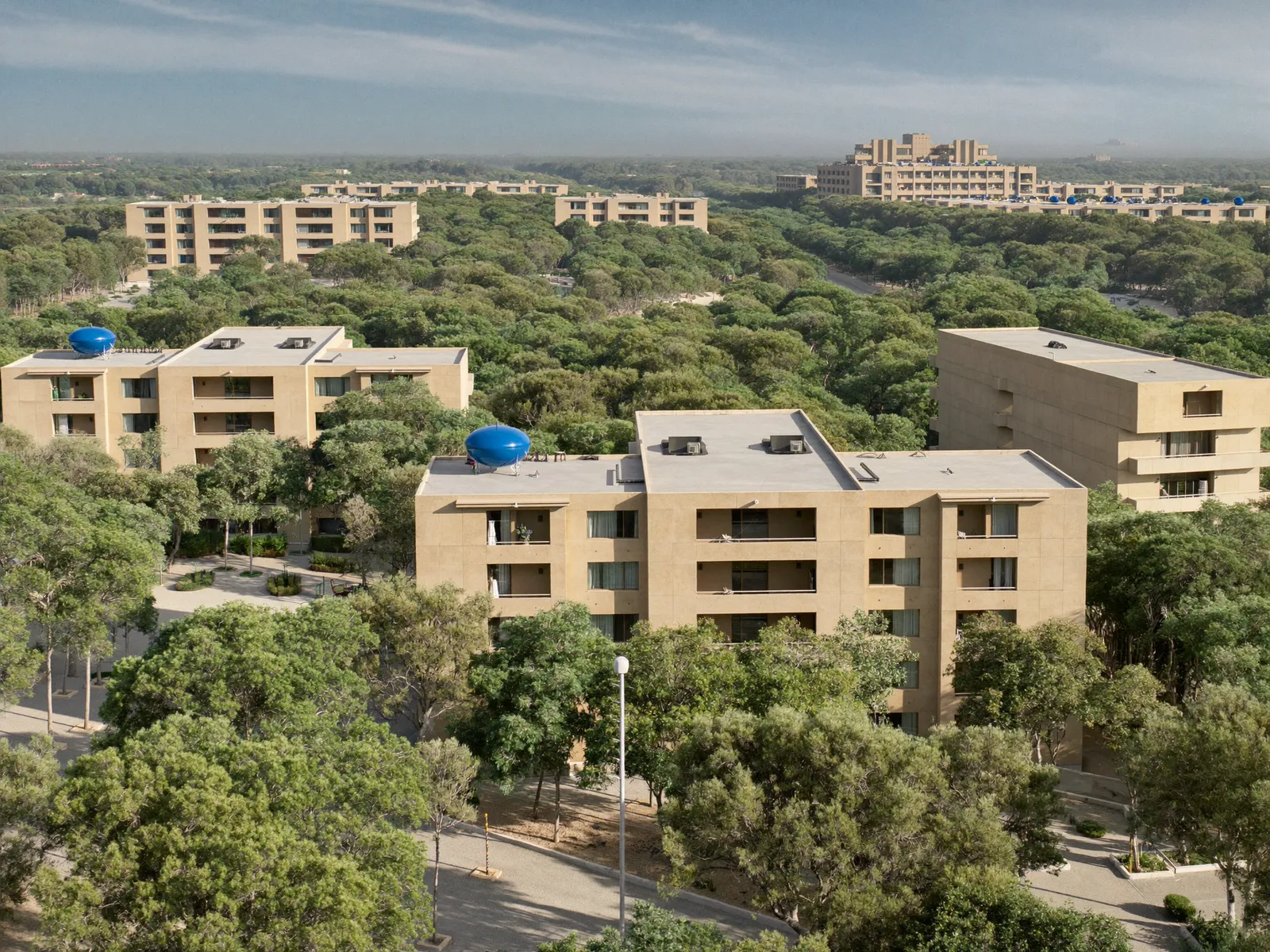 Low-rise apartment buildings in Discovery Gardens surrounded by trees and gardens