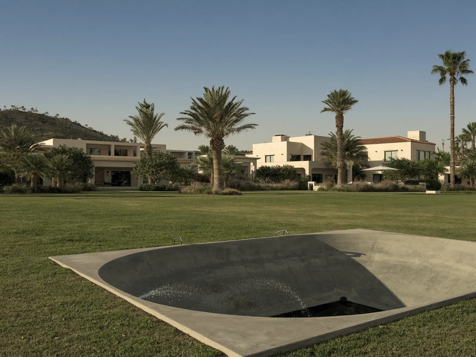 Family villa in Umm Suqeim with a large garden, palm trees and a service yard at the side